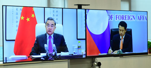 Wang Yi (L) meets online with his Lao counterpart Saleumxay Kommasith, February 3, 2020..jpeg