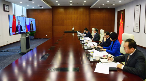 Wang Yi holds a video meeting with Saleumxay Kommasith, February 3, 2020..jpeg